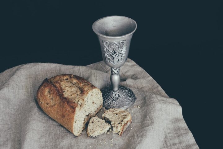 sliced of bread beside goblet